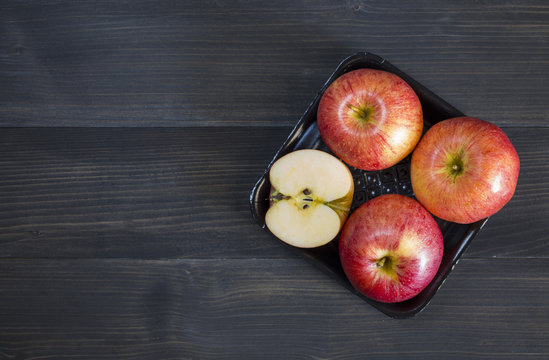 Fresh apples for health on the wooden background.