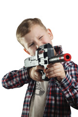 Little boy in shirt with a black gun