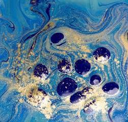 Blue and gold liquid texture. Hand drawn marbling background. Ink marble abstract pattern