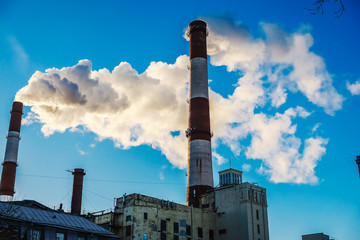 thick smoke belching from factory chimneys