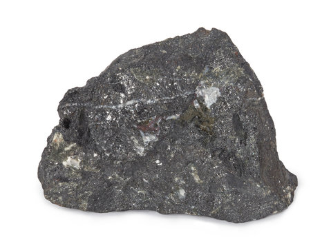 Mineral  magnetite isolated on white background. Magnetite is a mineral and one of the main iron ores. Magnetite is ferrimagnetic  it is attracted to a magnet and can be magnetized.