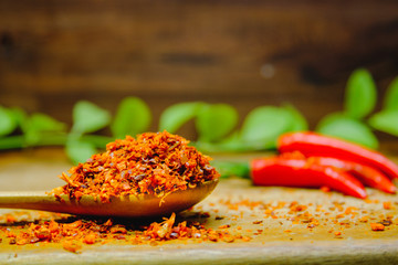 Red chilli peppers  hot spicy on a wooden. Chilli dried on wooden spoon.  Concept of hot food and Vegetable.