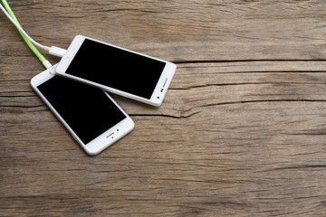 Smart phone on wooden background