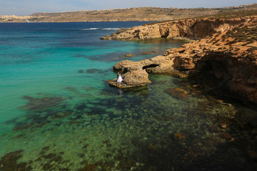 Fototapeta premium Groom and bride near the sea