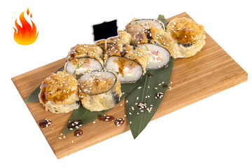 Sushi rolls on wooden Board with leaves of leeks and black sign for logo and name