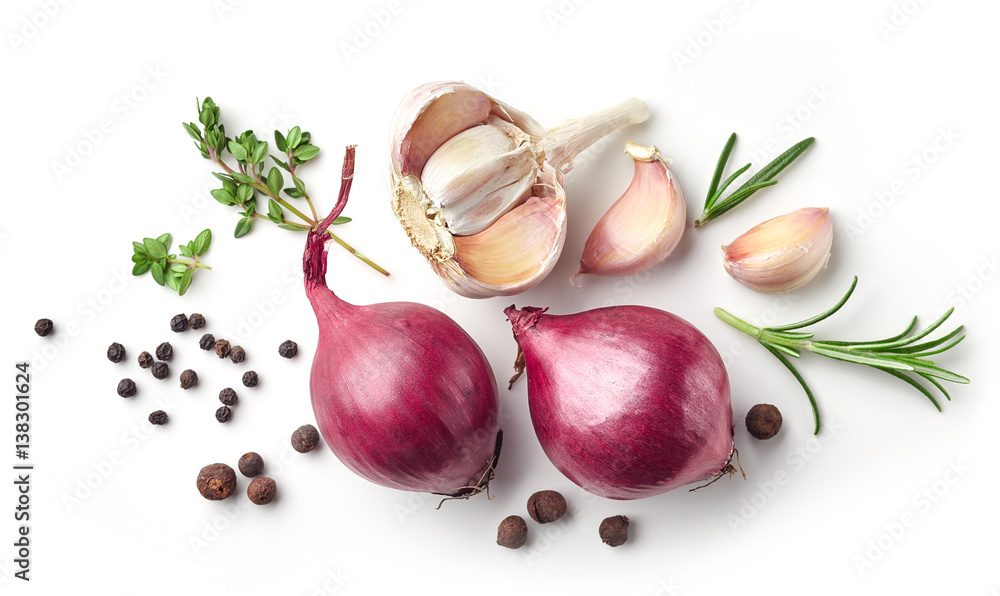 Wall mural red onions and spices on white background