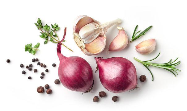 red onions and spices on white background