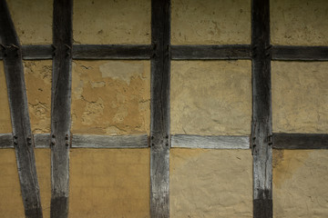 Old adobe wall of the half timbered house