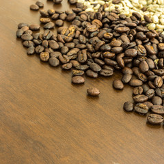 roasted coffee beans on the wooden table, can be used as a background