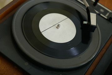 Retro record player, detail shot. Vinyl. Vinyl record.