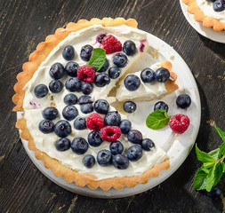 Tart with berries and whipped cream.