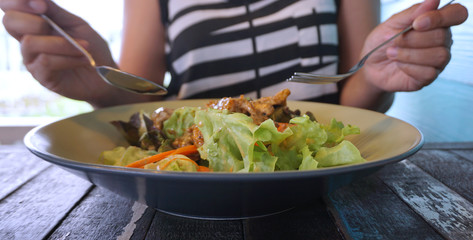 Eating Grilled barbecue pork salad