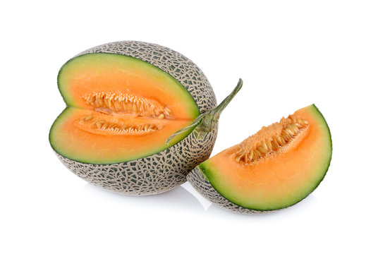 ripe cantaloupe with stem on a white background