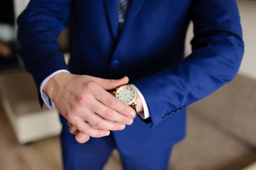 A man looks at his watch