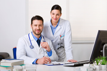 Two young doctors in white coat