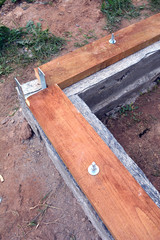 new  foundation construction with wood plank and anchor