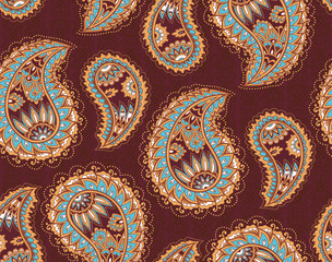 Vintage paisley seamless pattern. Ethnic ornament. Stylized decorative tribal painting. Traditional handcraft. Seamless texture in brown and light blue colors on dark background. Vector