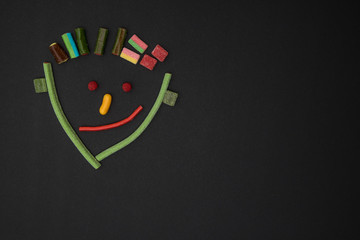 Obraz premium Funny face of a man made of sweets