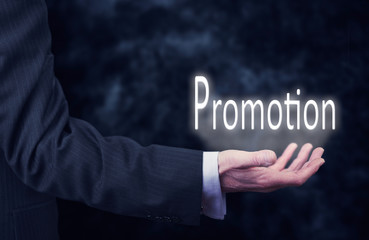 Hand holding a Promotion Concept