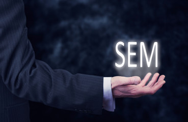 Hand holding a SEM Concept