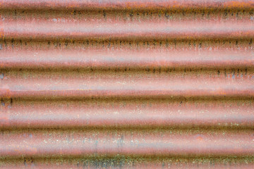old rusty corrugated metal sheet. horizontal wavy background texture