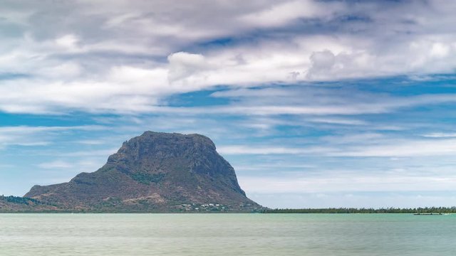 Paradise rocky tropical island day time lapse. Clouds over the Le Morne Brabant UNESCO World Heritage Site at day time. Mauritius.