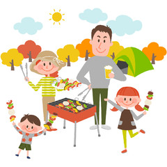 family enjoying barbecue outdoors