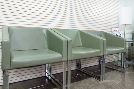 Waiting room with green armchairs