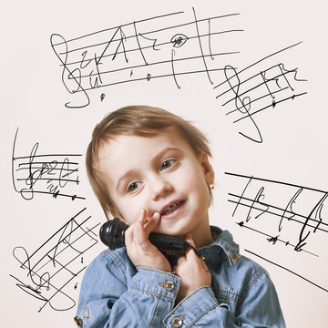 The famous actress. Humorous photo baby girl singing with a microphone (creativity, music, success concept)