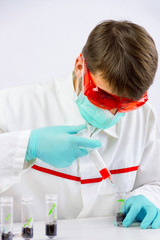 Scientist testing gmo plants in biological laboratory 