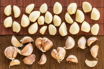 garlics top view on table wood background