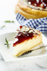 Cheesecake with berry sauce and almond