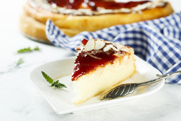 Cheesecake with berry sauce and almond