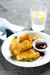 Fried fish stripes with bbq sauce