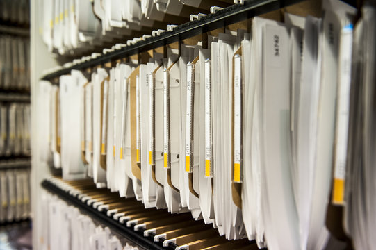 Close-up of document arranged in shelf