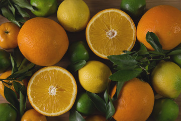 Upper view on citrus fruits with orange halves