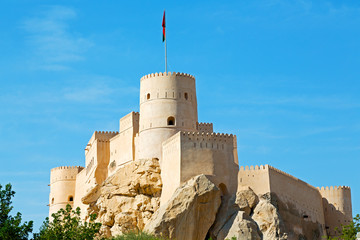 in oman muscat rock  the old defensive  fort battlesment sky and  star brick