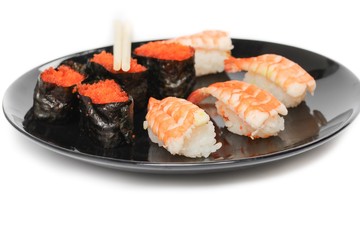 sushi set, shrimp and  rolls seaweed caviar in plate  on white background