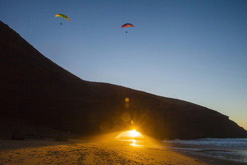 Seaside at Lezgira beach with paraglider, Morocco