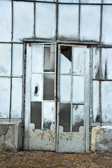 Door of abandoned greenhouse