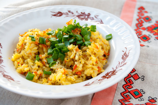 Plate of pilaf with green onions for lunch