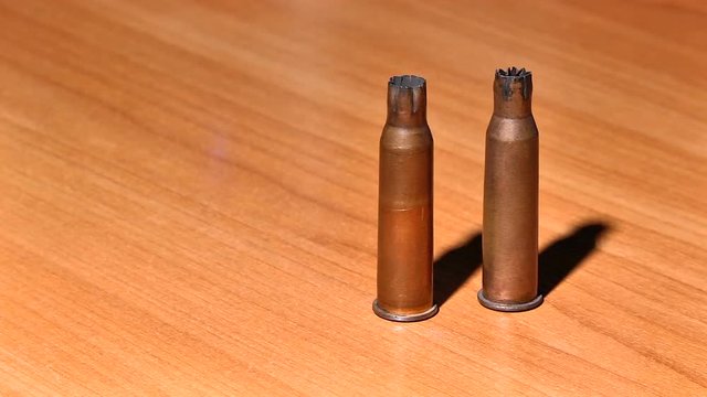 Three shells from a Russian rifle on the table