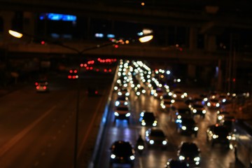 Abstract blurred bokeh in city night  colorful beautiful of traffic in Bangkok Thailand, with copy space