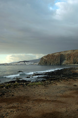 Sky cleaning after rain in Palm-Mar, with view towards Los Cristianos, Tenerife, Canary Islands