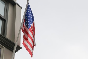 American flag on building, the  proudly displaying their