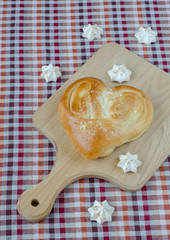 Sweet white meringue and bread in the form of heart.