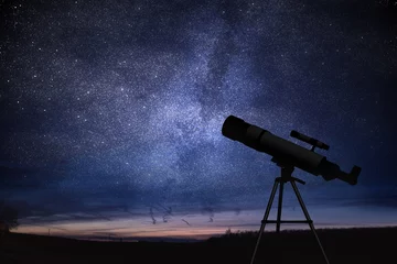 Fotobehang Silhouette of telescope and starry night sky in background. Astronomy and stars observing concept. © vchalup