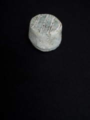 Blue cheese isolated on black background