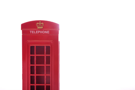 Classic British red phone booth on isolated white