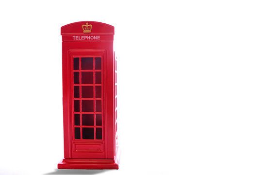 Classic British red phone booth on isolated white